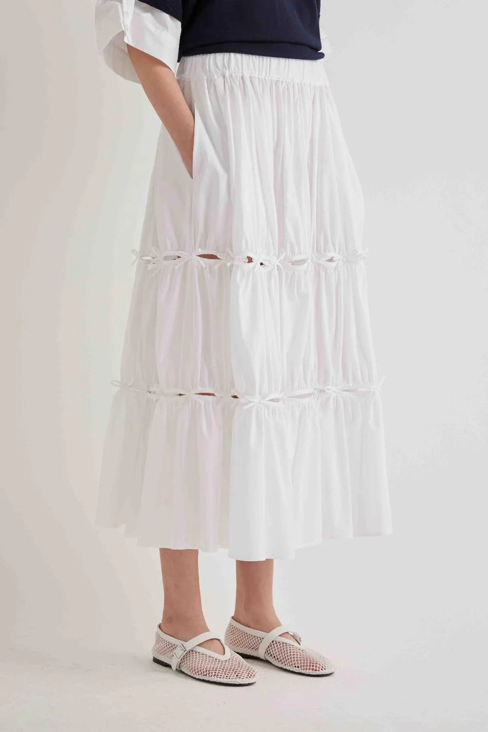 LONG RUFFLED SKIRT WITH APPLIED BOWS